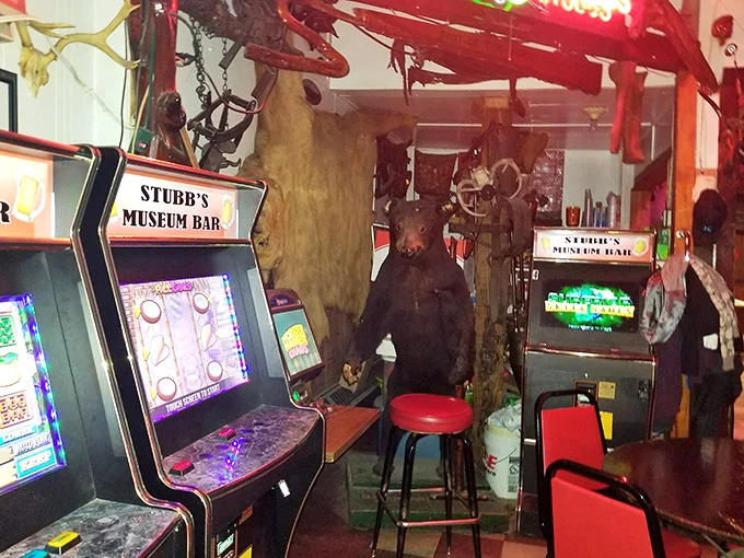 Arcade machines and museum displays at Stubb's Museum Bar