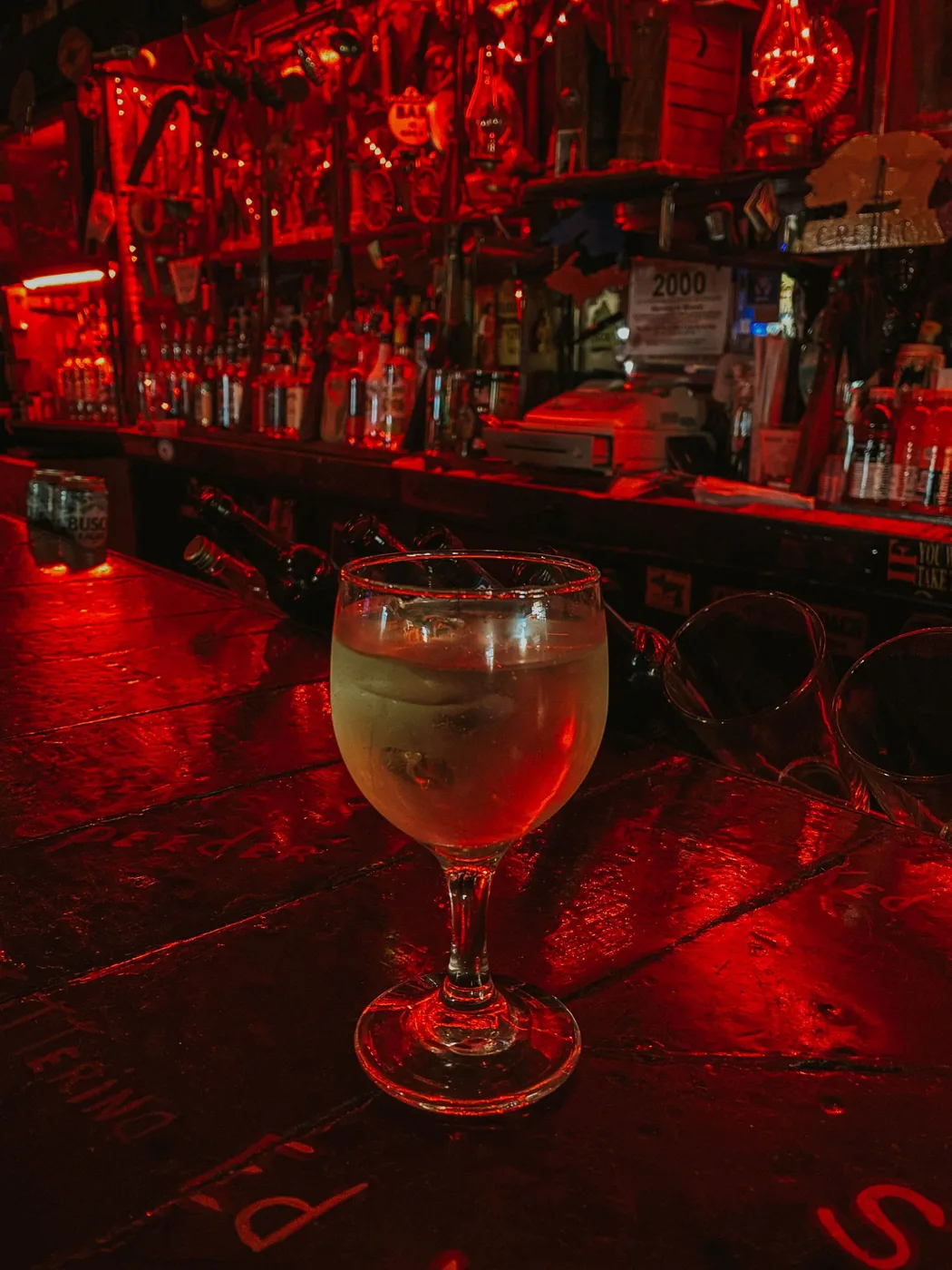 The red-lit bar interior at Stubb's Museum Bar