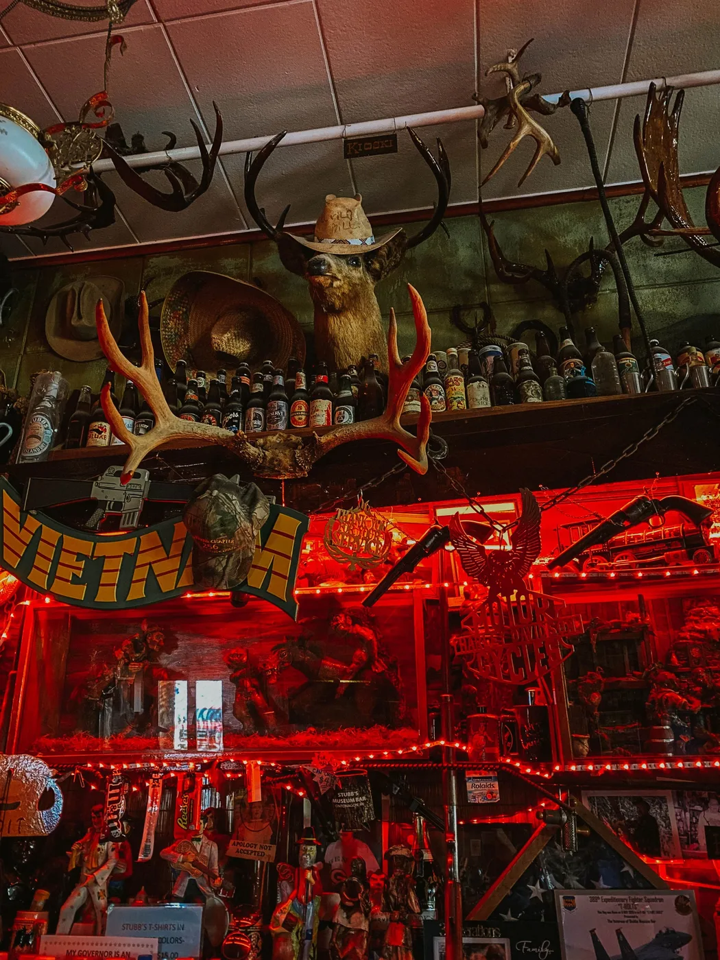 Red-lit memorabilia and displays at Stubb's Museum Bar